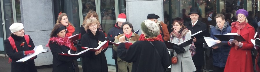 Marley's Angels carol singing outside Cobra Café in Museum Quarter